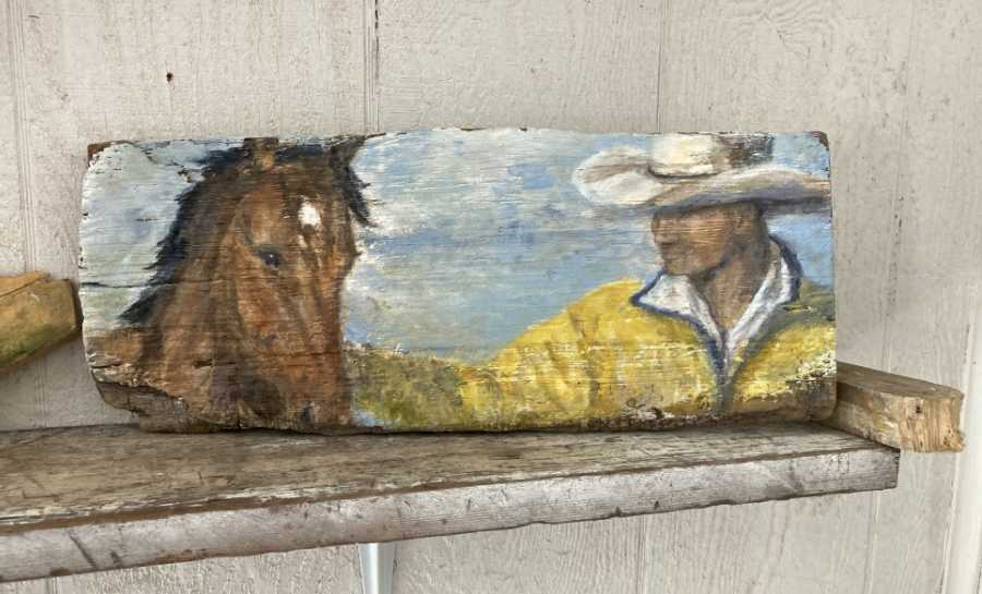 Cowboy and horse on wood